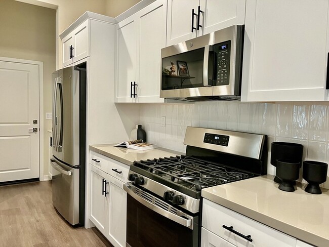 Building Photo - Brand New Custom MODEL 3 Bedroom 2.5 bath ...