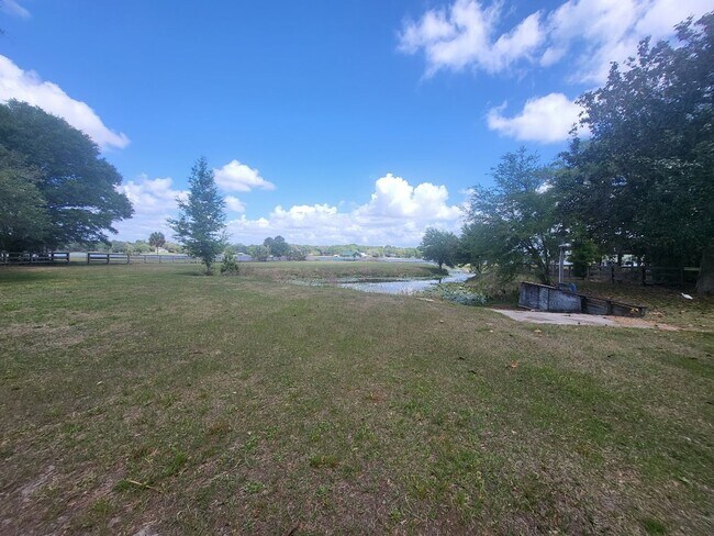 Building Photo - Little Lake Weir Waterfront FENCED 3BR/2BA on 6 Acres with Horse Barn, Private Boat Ramp & Dock