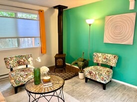 Living room with wood stove - 1614 Groves Ave NW