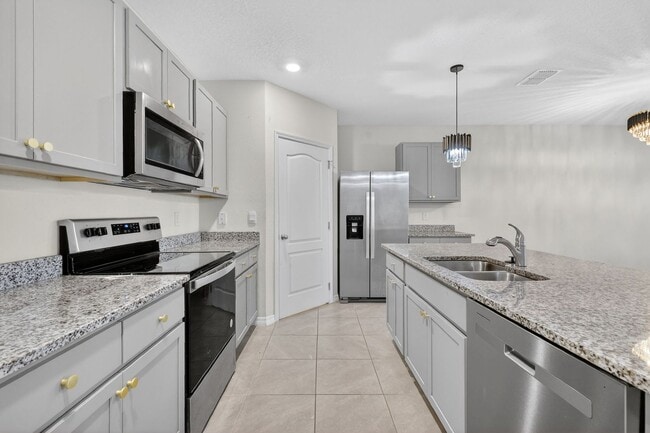 Building Photo - Available Now in Tavares | 2023 Built 4BR/2BA Home with 2-Car Garage