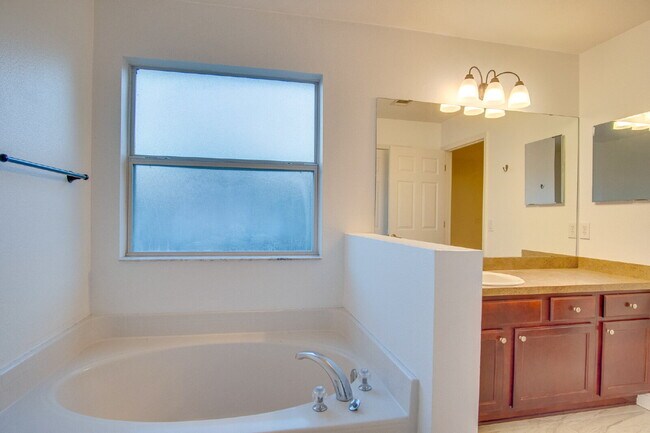 Building Photo - Energy-Efficient 3BR/2BA Solar Home in Pace with Screened Porch, Fenced Backyard, Updated Kitchen...