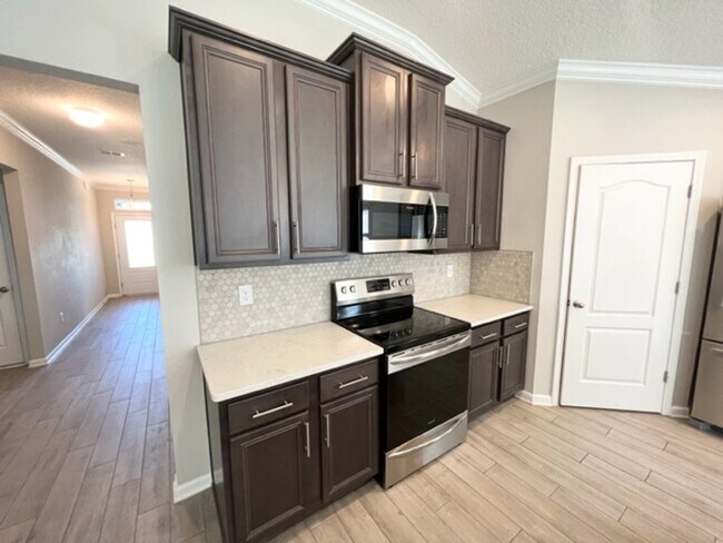 Building Photo - Introducing this stunning 4-bedroom, 2-bat...