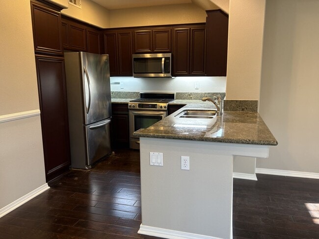 Building Photo - Tri-Level Condo within Walking Distance to...