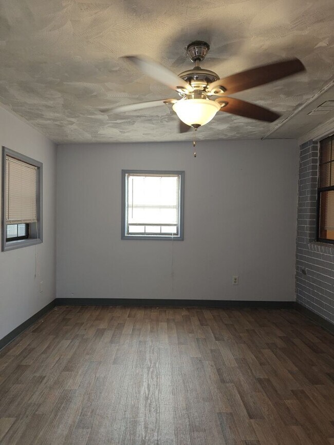 Building Photo - Elegant & Spacious 3-Bedroom Brick Home with Private Garage