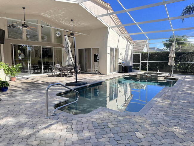 Building Photo - Stunning 5-Bedroom Pool Home in Gated Spyg...