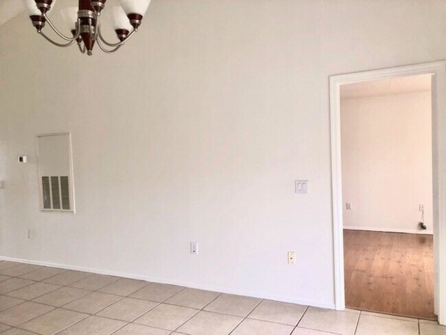 Building Photo - Nice 2X2 located on 2nd floor- Tile & lami...