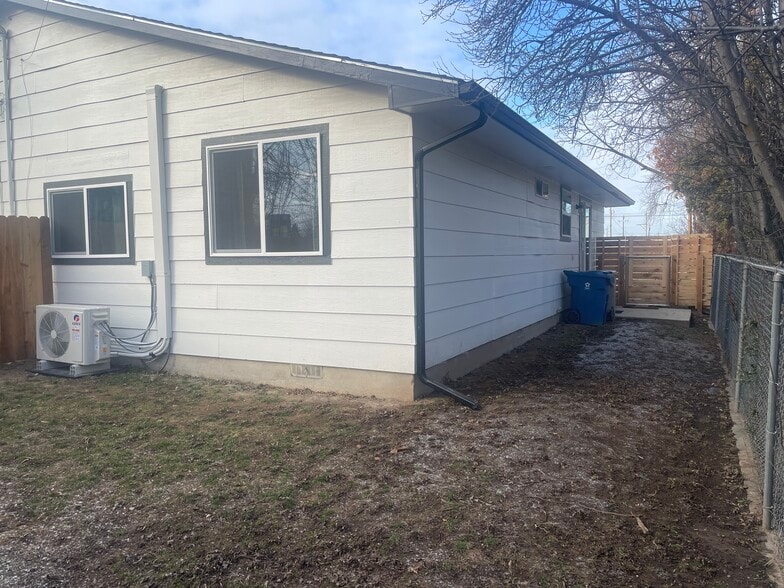 Patio with retractable awning being installed - 1540 S Wardle St