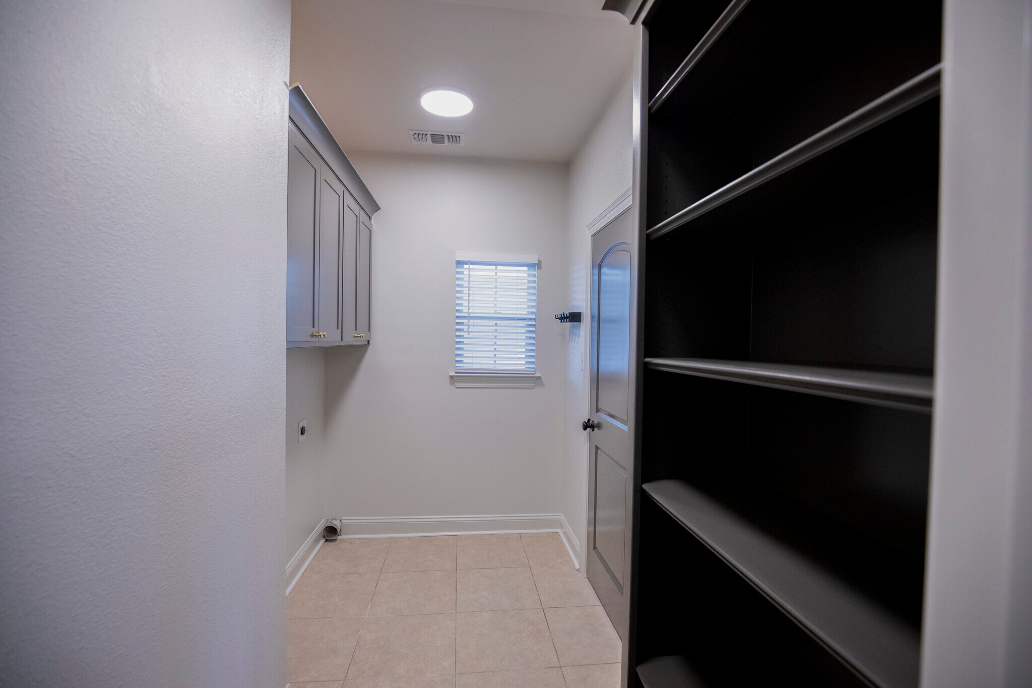 Laundry with ample storage - 11284 Shelly St