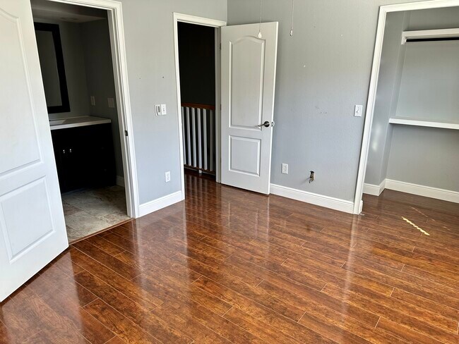 Bedroom 1 with full bathroom and large closet - 2871 S Pines Dr