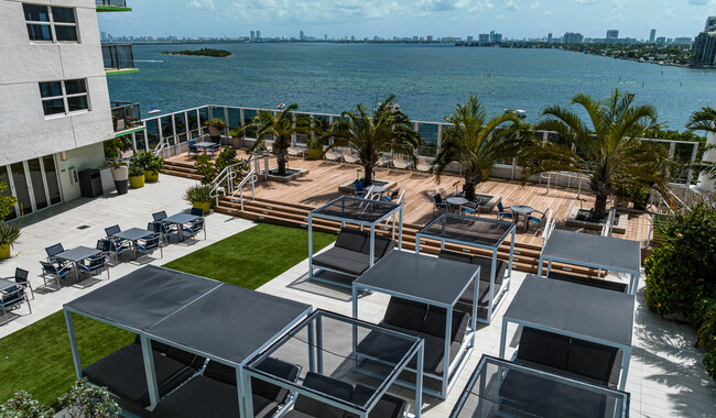 Expansive pool deck with cocktail service and stunning views of Biscayne Bay - Bay Parc Apartment Homes