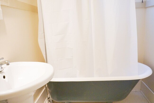 Building Photo - Charming Buckman Studio: Hardwoods, Walk-in Closet & More!