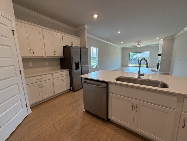 Building Photo - "NEWLY BUILT- Spacious 4-Bedroom Haven with Granite Elegance and Cozy Fireplace in Harvest"