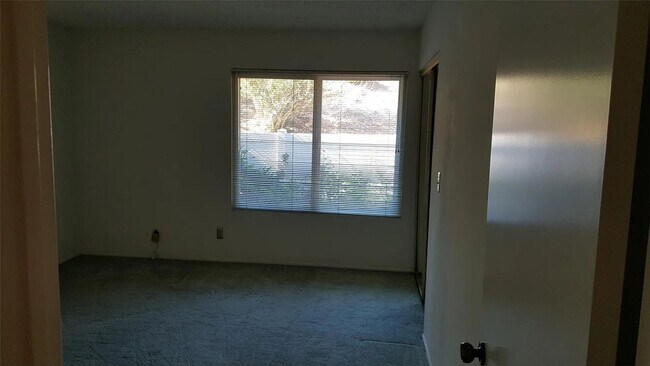 Building Photo - Available Now is a Condo style Townhouse i...