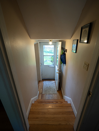 On landing from hallway looking to back door. - 522 N Blackhawk Ave