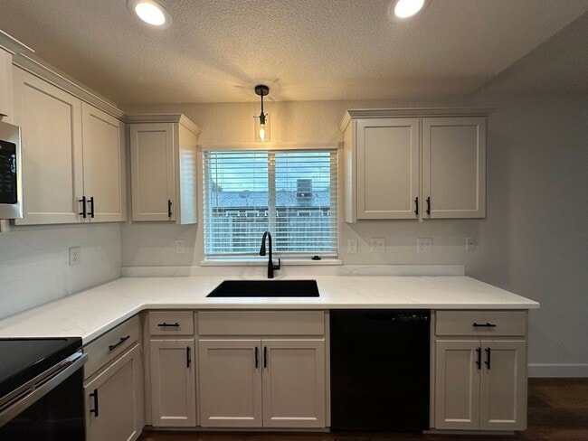 Building Photo - Updated Home with Island Kitchen, LVP Flooring, and Yard Care Included!
