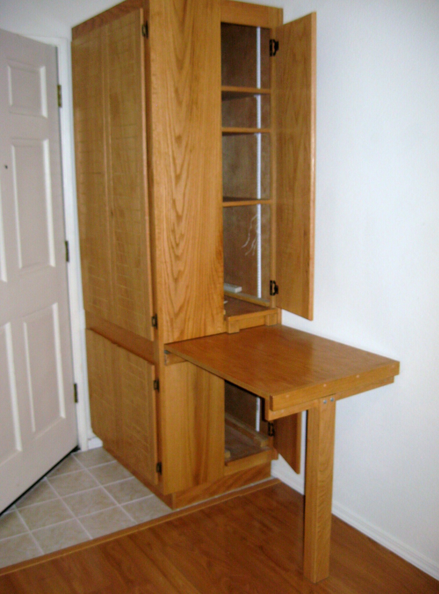 Lots of cabinets and built-in computer desk. - 6999 Rodling Dr