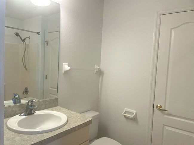 Building Photo - Elegant 3 Bedroom End-Unit Condo with Screened Lanai & Pond Views and A Private Garage