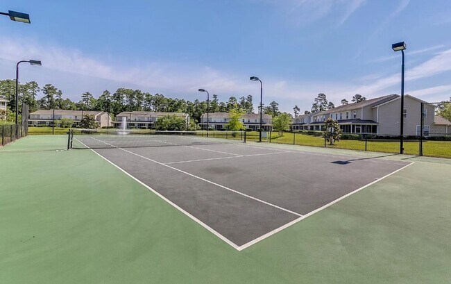 Building Photo - Relax and Unwind in this Spacious End-Unit...