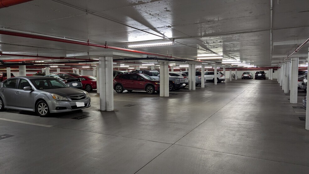 Secure subterranean parking garage with hundreds of spots, many available for rent from neighbors. - 490 M St SW