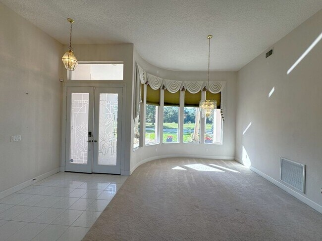 Building Photo - 4/3 Pool Home in Pelican Bay