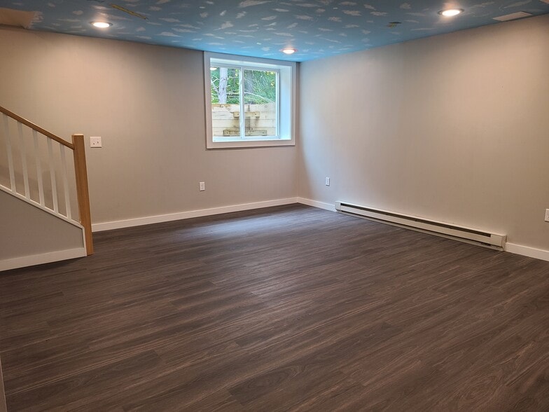 The basement is bright with high ceilings. - 24 Wilsons End Pl