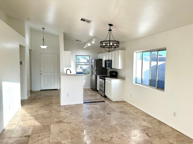 Building Photo - Adorable single story, corner lot home with 3 bedrooms, 2 bathroom and 2 car garage with a huge b...