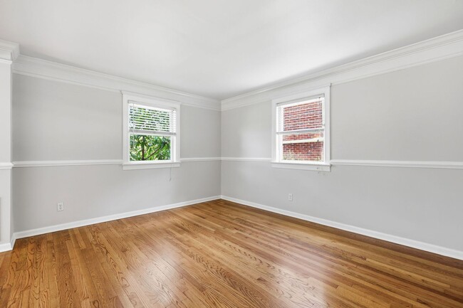 Building Photo - Updated 2BR Condo | Walk to Village District + Private Deck!
