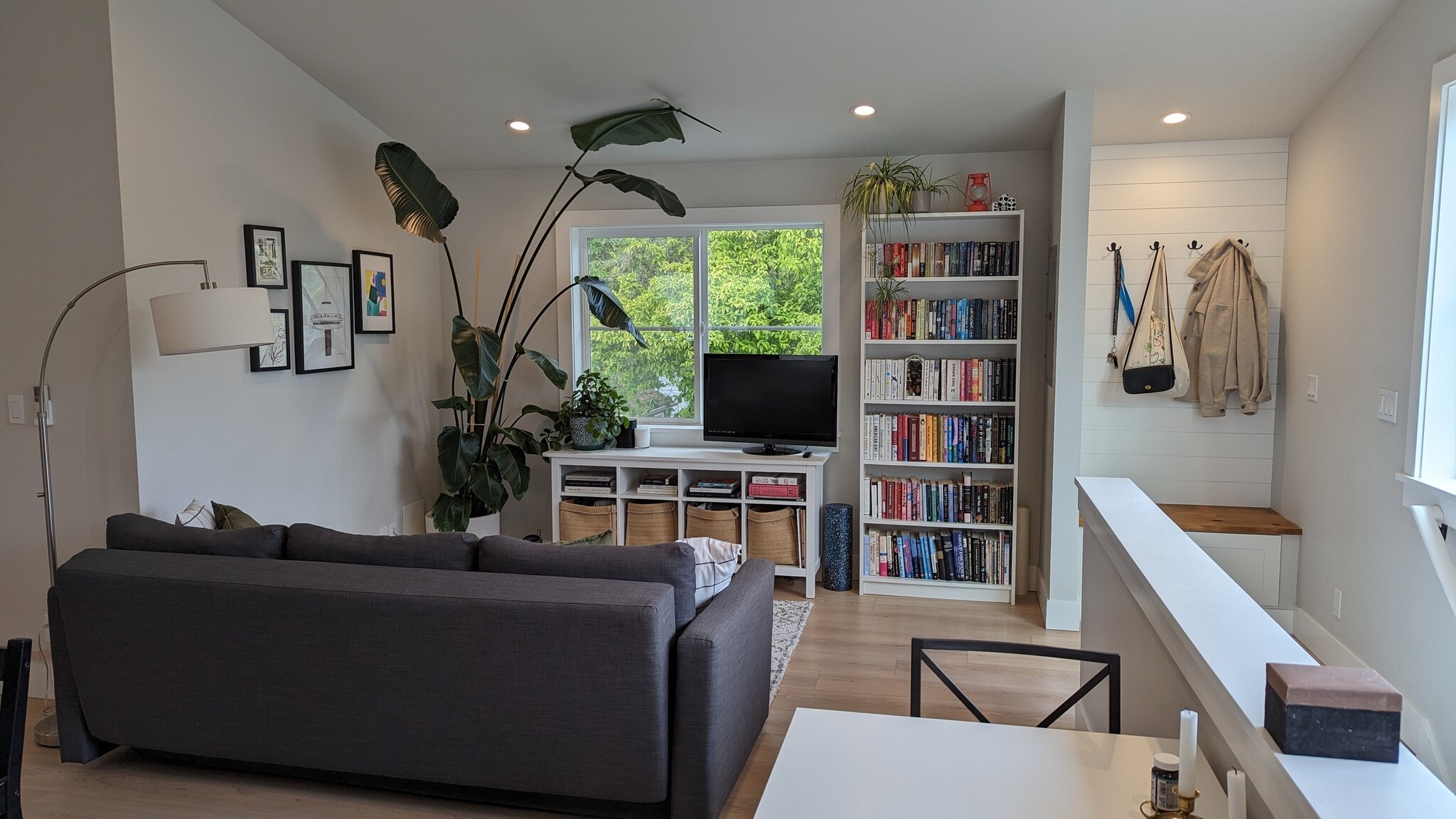 Living room with great natural light and view of trees - 3240 29th Ave W