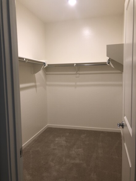 Master walk-in closet. - 23615 W watkins st