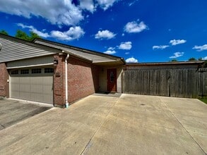Building Photo - 3 bedroom home w/ privately fenced yard + hot tub.