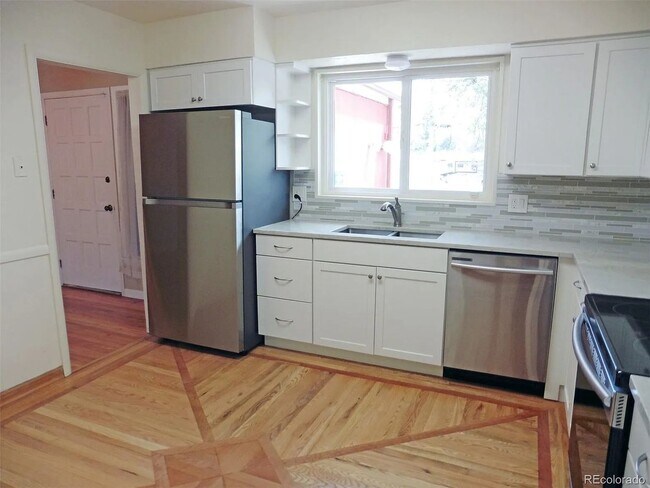 Building Photo - Spacious Littleton Home with Large Fenced Yard & Attached Garage!
