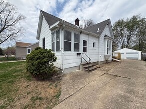 Building Photo - Classic Hardwood Floors, Fenced Yard & 2-Car Garage