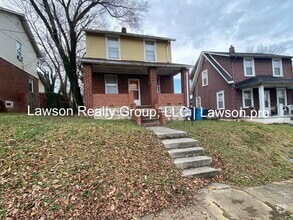 Building Photo - Updated Three Bedroom with Flat Yard