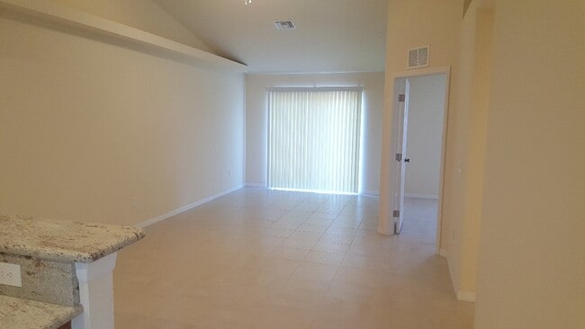 Building Photo - NEWER 3 bedroom 2 bath 1 car garage duplex in SW Cape!!  Lawn Care Included~