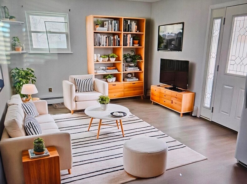 Staged image of living room. - 247 Bellerose Ave