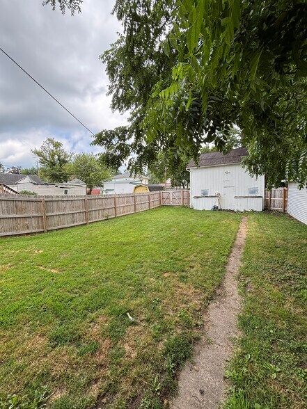 Fenced in backyard with barn - 111 Oak St