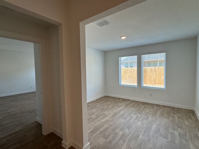 Building Photo - BRAND NEW 4 BR / 2 BA with THREE-CAR GARAG...