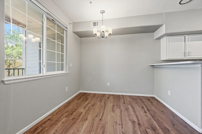 Building Photo - $1,745.95 - Ground-Level 1 Bed + Flex Room | 1.5 Bath Condo with Community Pool