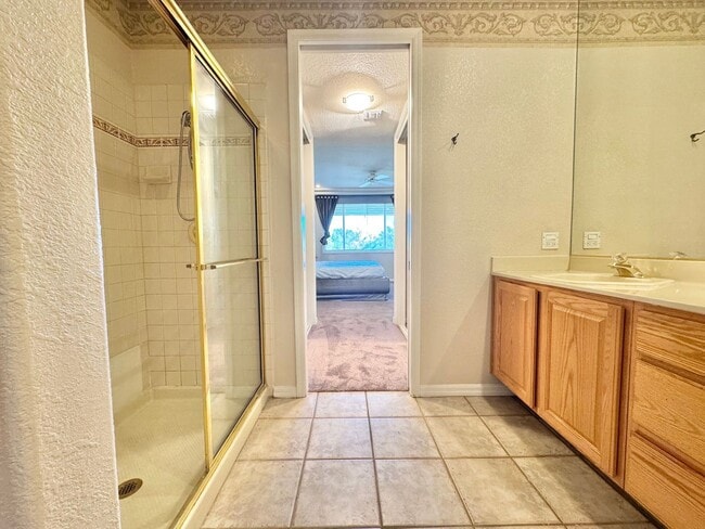 Building Photo - MOVE IN SPECIAL WITH THIS BEAUTIFUL GATED COMMUNITY - TOP FLOOR CONDO WITH BALCONY IN SUMMERLIN