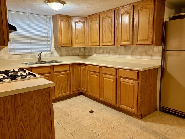 Oakwood cabinetry in Kitchen - 6747 N Harding Ave