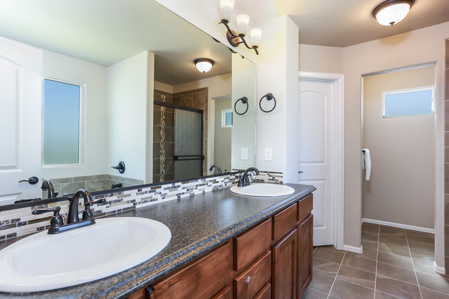 Bathroom looking into Walk-In closet (door closed) and stool area (not pictured) - 3453 Curlew Dr