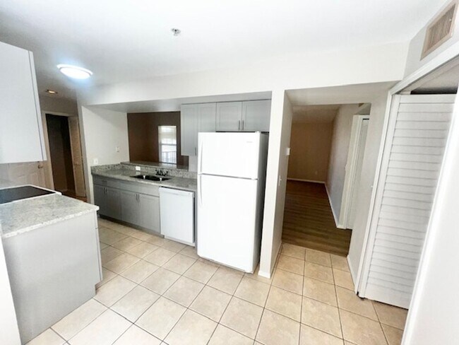 Building Photo - NEW-Remodeled bathroom & kitchen! NEW VINYL PLANK flooring & fresh paint! 2 bedroom 1 bath condo ...