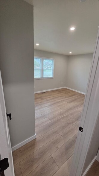 Master bedroom : completely renovated and features two brand-new closets - 604 Holly Ln