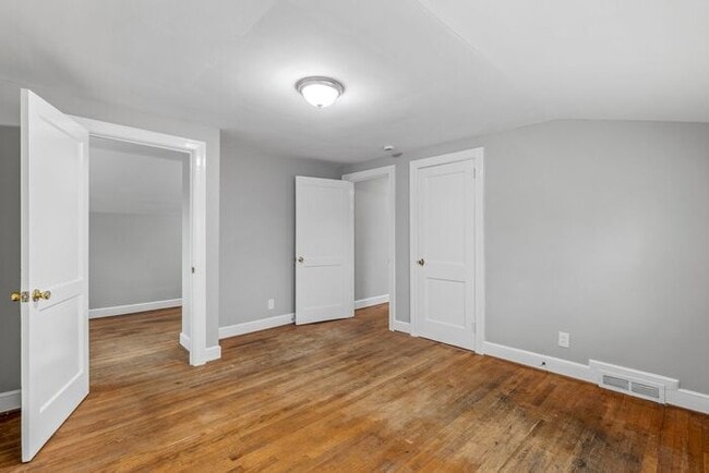 Building Photo - Brick home, Two Story, Hardwoods, DR, 2 Sun Rooms, FP, Carport!.