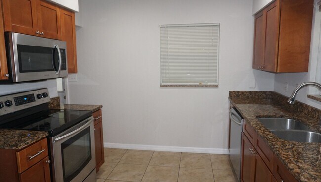 Building Photo - Four Bed - Three Bath - Large Storage Area...