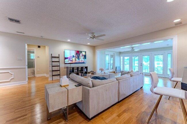 Building Photo - Lake Jessamine Luxury: Solar-Powered Waterfront Retreat on 1.14 Acres with Dock & Boathouse