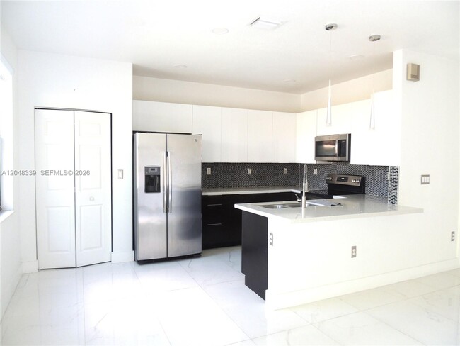 Building Photo - 9336 W 34th Ct