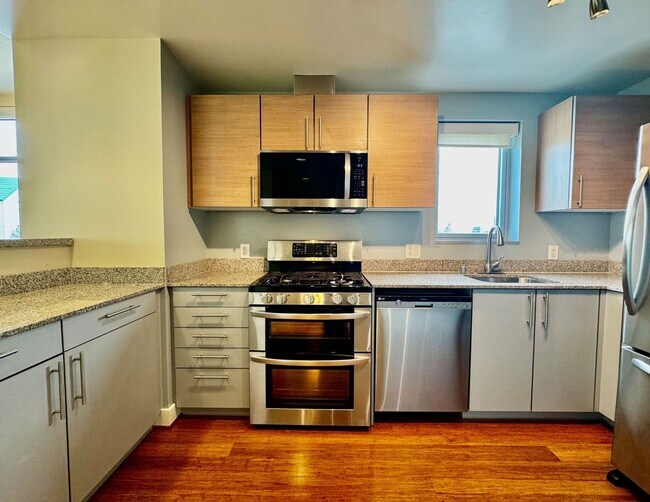 Building Photo - Corner Light. City Energy. Zero Compromise.