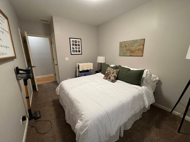 Bedroom 2 with 2 closets and window on opposite wall - 1241 N Maplewood Ave