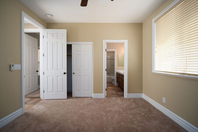 Second bedroom with direct access to jack-n-jill bath and large slider closet. - 2850 Bronzino Ct